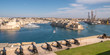 Panorama, skyline of the Maltese capital city Valletta. The Saluting Battery of La Valletta and Fort St. Angelo of La Vittoriosa in Malta