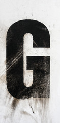 Written Wording in Distressed State Typography Found Letter G