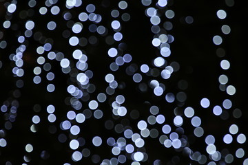 Light line blurred silver bokeh glitter background, light for decoration department store in merry Christmas and happy New Years festival, lifestyle night lighting bokeh