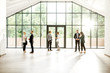 © rh2010 - Business people at the spacious modern hall with big window overlooking on the park. Wide view with copy space