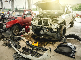 Damaged accident car waiting for repair in the garage.