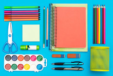 School Supplies On Blue. Top View.