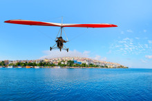 The Motorized Hang Glider  Flying Over The City