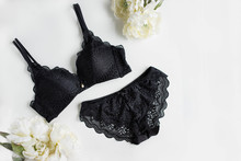 Classic Black Underwear Set On The White Background With Flowers