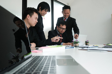 Wall Mural - business adviser analyzing company financial report. professional investor discussing idea. businessman working on startup project with co working team.