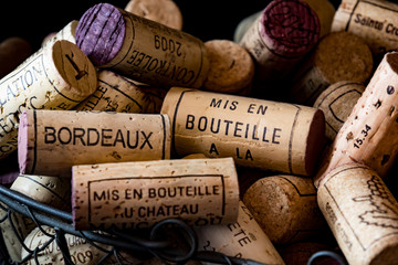 old cork stoppers of French wines in a wire basket