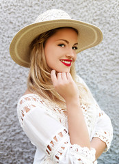 Young smiling woman wearing hat