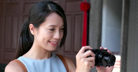 Sticker - Woman taking photo on camera when travel