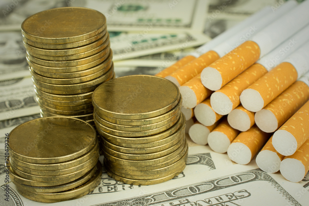 cigarette coin Cost of smoking, Cigarette price concept. Cigarettes money gold coins Stock  Photo