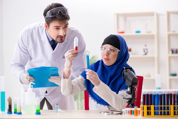 two chemists working in the lab