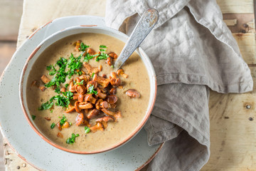 Top view of tasty mushrooms soup with chanterelles