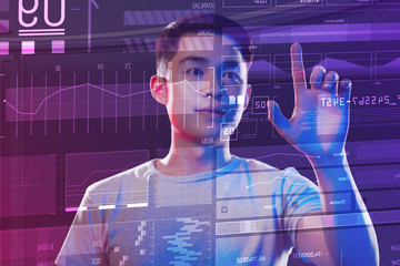 Attentive worker. Calm clever professional programmer working in his modern equipped office and touching the icon on the transparent screen with one finger