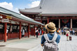 Young traveler taking photo of Sensoji temple in asakusa, Tokyo, Japan