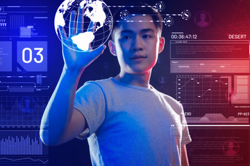 realistic hologram. calm attentive programmer thoughtfully looking at the realistic model of the ear