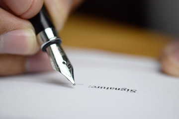 Poster - Signing a form
