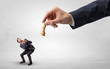 © ra2 studio - Big hand holding chessman and down little afraid businessman concept in a light space