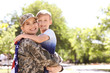 © New Africa - American soldier with her son outdoors. Military service