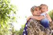 © New Africa - American soldier with her son outdoors. Military service