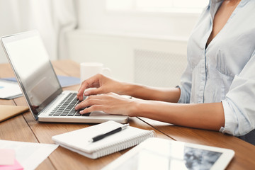 Poster - Female hands working on laptop with blank screen