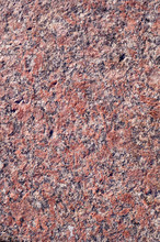 Red Granite Background. Texture, Pattern, Vignette.