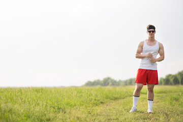 young man is standing on the grass