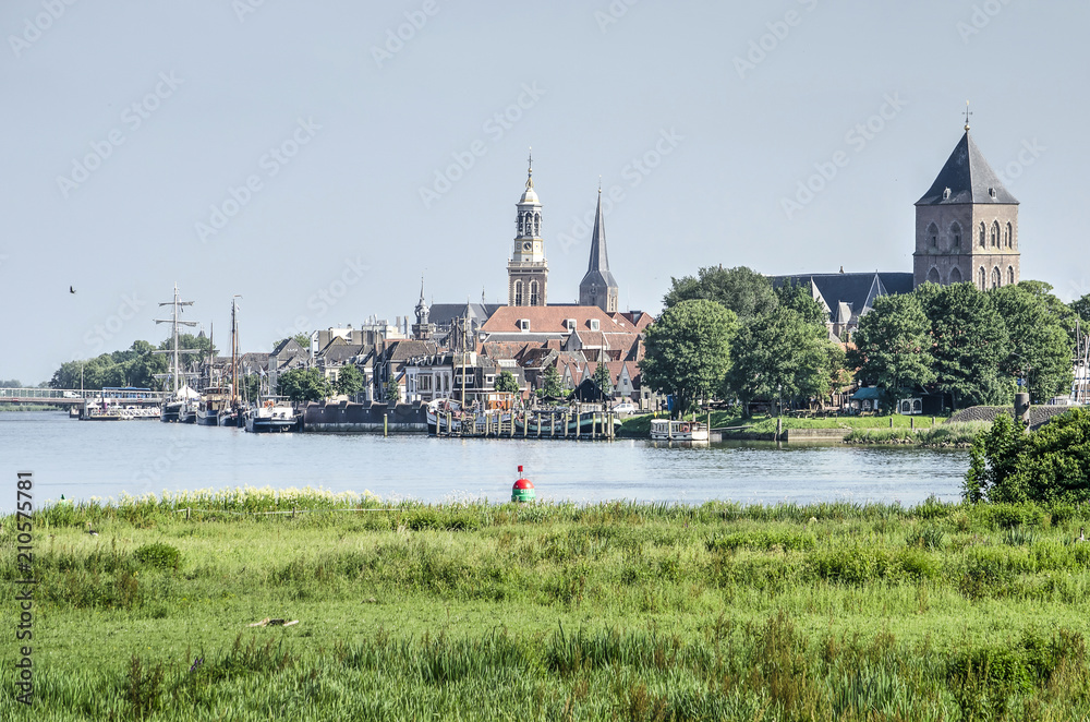 View across the river IJssel and its floodplain towards the old Hanze city of Kampen, The Netherlands - obrazy, fototapety, plakaty 