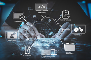 Wall Mural - businessman hand working with modern computer in modern office with virtual icon diagram