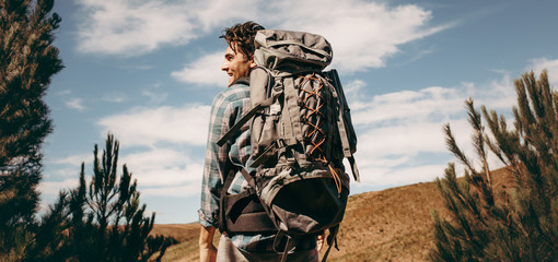 Wall Mural - man with backpack going on a camping