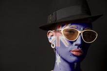 Portrait Of Woman With Painted Australia Flag And Sunglasses