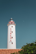 Concha Lighthouse Against Blue Sky With Moon In Punta De Maisi, Guantanamo Cuba