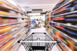 © Maha Heang 245789 - Abstract Defocused Blurred of Consumer Goods and Shopping Cart in Supermarket Store, Shop Trolley Basket in Department Store. Business Retail Customer Shopping Mall Service, Convenience Supermarkets