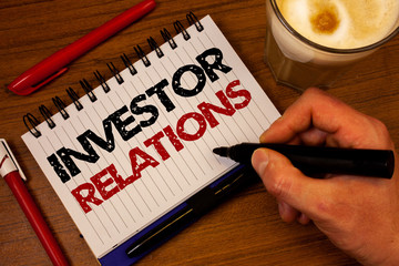 Poster - Word writing text Investor Relations. Business concept for Finance Investment Relationship Negotiate Shareholder Hand grasp black marker wooden desk red pen notepad expos texts coffee.
