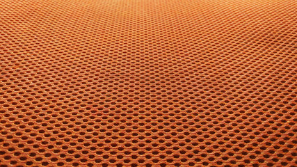 Orange nylon fabric pattern texture background.