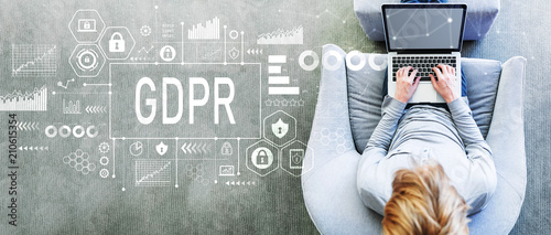 Fotografía GDPR with man using a laptop in a modern gray chair