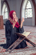 © FS-Stock - Young muslim woman praying with rosary in mosque