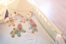 Close-up Baby Crib With Musical Animal Mobile At Nursery Room. Hanged Developing Toy With Plush Fluffy Animals. Happy Parenting And Childhood, Expectation Delivery Of A Child Concept