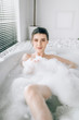© Nomad_Soul - Sexy woman lying in bath with foam