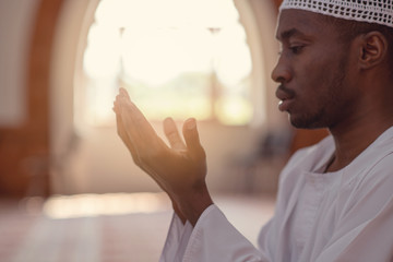 Wall Mural - Muslim Man Is Praying In The Mosque