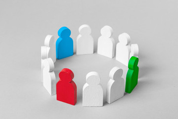 Wall Mural - Concept leader of a business team. Crowd of white men stands in  circle and listens to the leader of blue and red and green