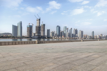 Urban skyscrapers with empty square floor tiles