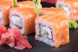 © Abramov Maksim - Японская кухня. Горячие и холодные закуски из морепродуктов. Суши и роллы и креветки. Японская еда и морепродукты в ресторане.
