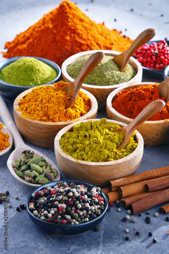 Variety of spices on kitchen table Canvas Print