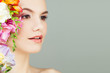 © artmim - Beautiful Young Woman with Vivid Flowers. Spa Beauty, Aromatherapy and Skincare Concept