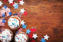 Cupcake Decorated With American Flag For Happy Independence Day 4th July Background. Holidays Table Top View.