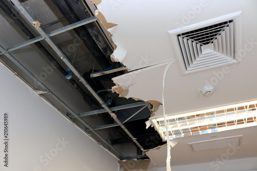 Ceiling Panels Damaged Hole In The Roof Of House From Drain Pipes