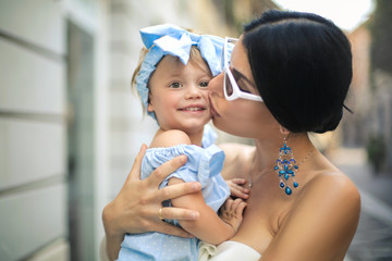 lovely mother kissing her sweet baby