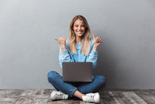 Happy Young Blonde Girl Using Laptop Computer
