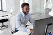 © Syda Productions - business, people and technology concept - african american businessman with computer working at office