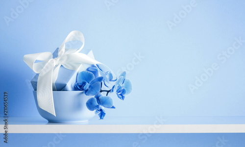 Light Blue Festive Background With Flowers Gift Box With White