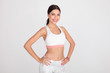 © Viorel Sima - portrait of confident fit girl in white gym outfit standing